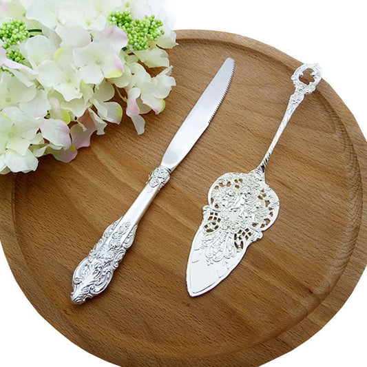 ALDO Party & Celebration > Party Supplies > Party Favors > Wedding Favors New / Stainless steel / Cake Knife cutter: 9.25 inch/ 23.5 cm      Cake shovel: 8 inch/ 20.5 cm Beutiful Laxury Bride and Groom British Court Silver-Plated  Cake Knife and Cake Shovel Set