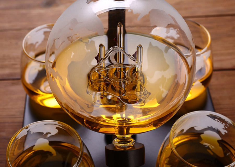ALDO Home & Kitchen>Cups, Mugs, & Saucers New / Borosilicate Glass / 5" W x 9.5" Inches long Globe Crystal Led Free Glass Decanter Bottle With Ship Inside Four Glasses and Holder Set For Liquor Wine Whisky Vodka