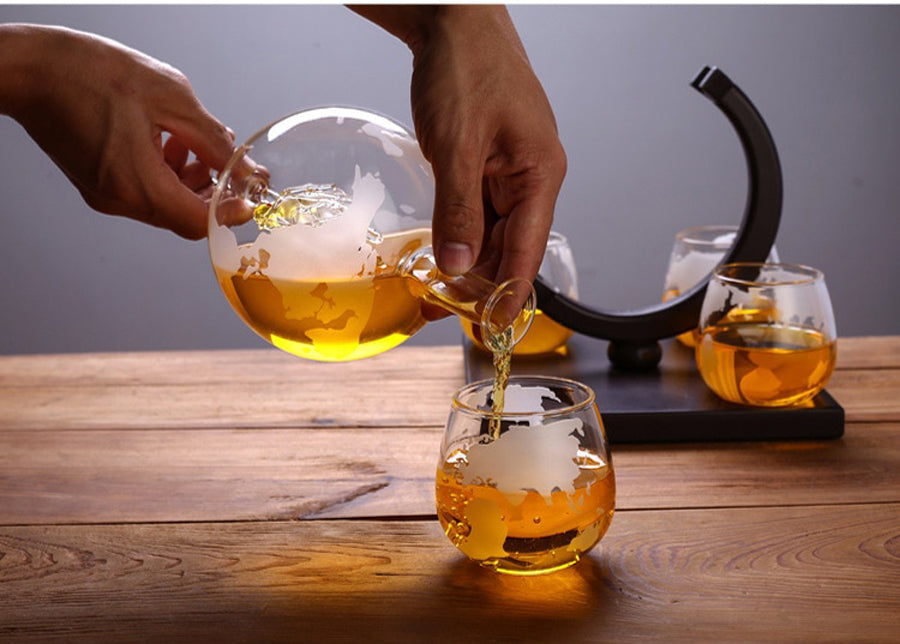 ALDO Home & Kitchen>Cups, Mugs, & Saucers New / Borosilicate Glass / 5" W x 9.5" Inches long Globe Crystal Led Free Glass Decanter Bottle With Ship Inside Four Glasses and Holder Set For Liquor Wine Whisky Vodka